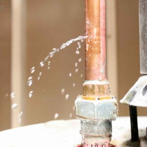 an image of a water heater with burst pipes.