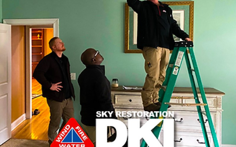 Technicians working in a customer's home.